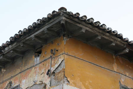 detail from the roof of abandoned old house in athens greeceの写真素材
