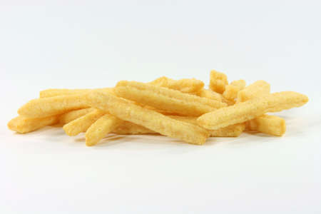 closeup of crunchy yellow cheese snacks in white background
