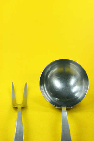 food and restaurants concepts cooking tools in yellow backgroundの写真素材