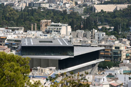the new museum of acropolis in background can see the pillars of sports competition zeus and kalimarmaro stadium landmarks of athens greeceのeditorial素材