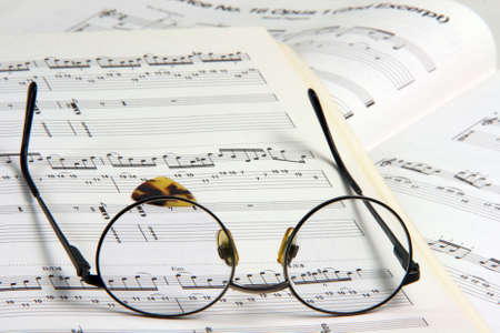 education concepts study music spectacles on a music book and guitar pickの写真素材