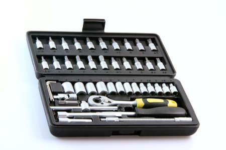 tools set in plastic case spanner bit sockets and screwdrivers isolated on white background