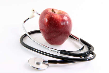 healthy food red apple and phonendoscope health and medical objects isolated on white background