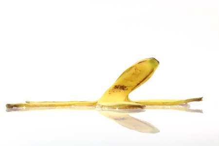peel of banana with reflection isolated on white background dangerous coceptsの写真素材