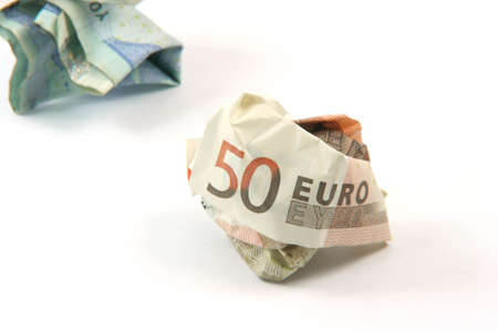 two crumpled euro banknotes isolated on white background with copy spaceの写真素材