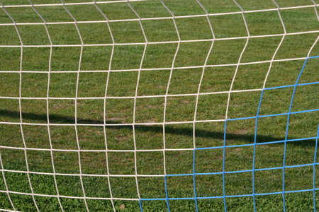 goalpost net detail with green grass  background sports concepts