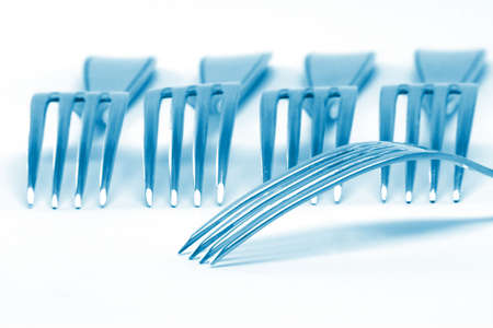   blue color forks detail isolated on white background food industry conceptsの写真素材