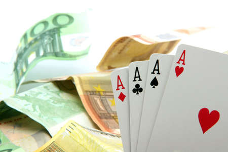 gambling four aces closeup and euro banknotes background
