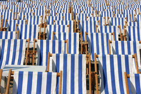 blue and white chaise longues texture and tables summer conceptsの写真素材