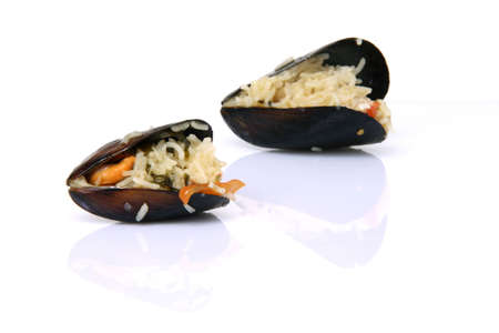 gourmet two mussels cooked with rice isolated on white background with reflectionの写真素材