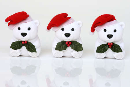 celebration objects three white santa bears on white backgroundの写真素材