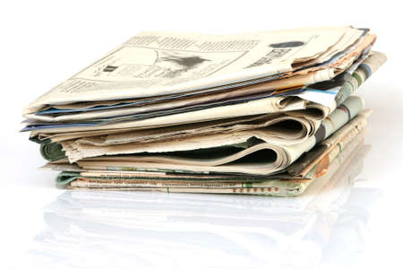 media concepts stack of newspapers with reflection isolated on white background