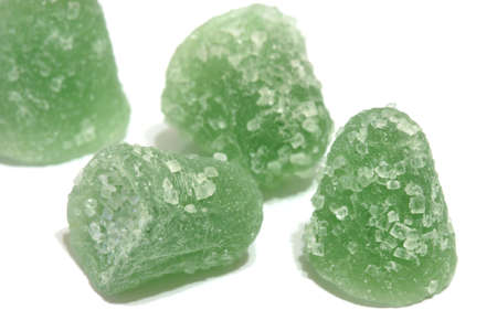 macro detail green jelly sugar candy isolated on white backgroundの写真素材