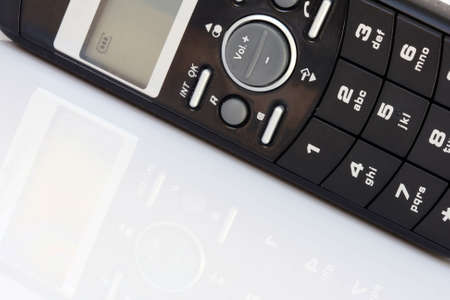 black telephone  closeup isolated with reflection and copyspaceの写真素材