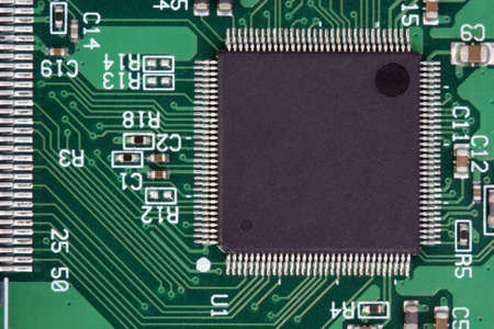 black processor on green circuit board detail with copyspace