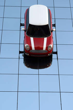 red and white car on glass wall reflectedのeditorial素材