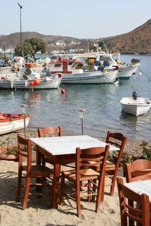 beach  restaurant and fishing boats at patmos island greeceの写真素材