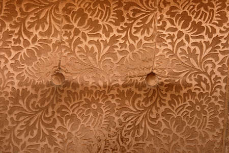 abstract retro golden velvet textile detail with butons from couchの写真素材
