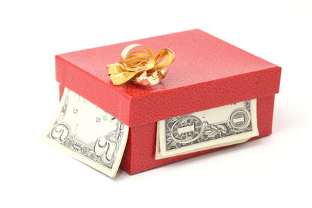 expensive red gift box with gold bow and dollars isolatedの写真素材