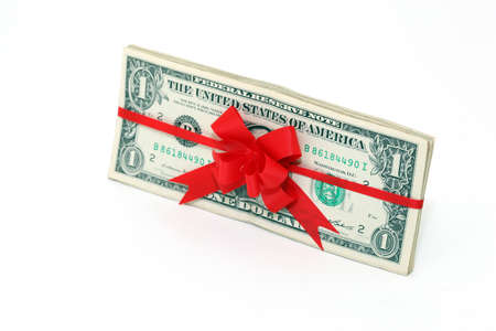 dollars gift banknotes present with red ribon and bow isolatedの写真素材