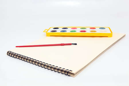 spiral painting block with brush and watercolor paletteの写真素材