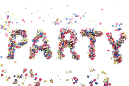 party word with confetti isolated on white backgroundの写真素材