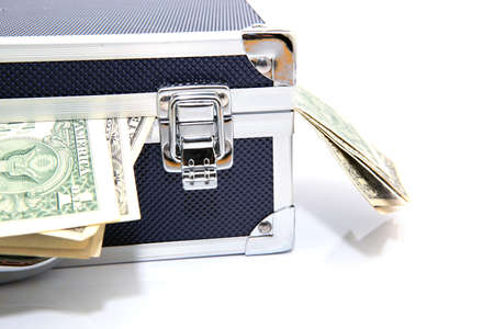 detail of black metalic case closed with money isolated horizontalの写真素材