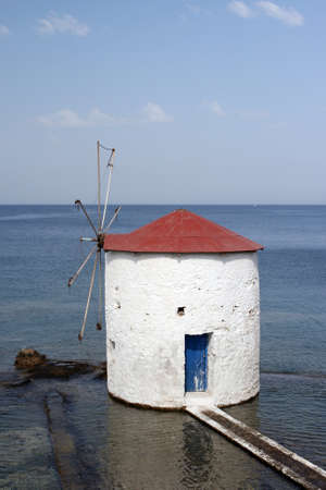 floating white water mill in the sea Leros island dodecanese greeceの写真素材