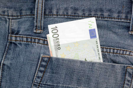 blue jean and hundred euro banknotesの写真素材