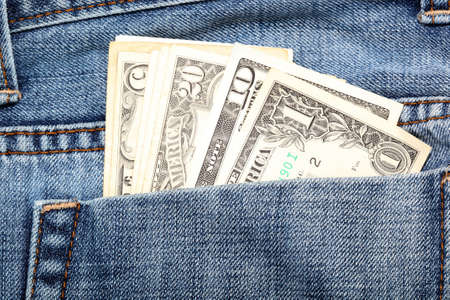 closeup detail dollar notes in back pocket of jeanの写真素材