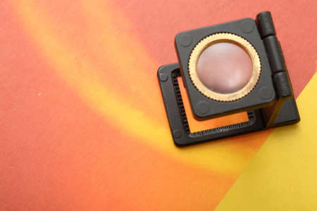 lithography and printing industry magnifaying glass on parer with copyspaceの写真素材