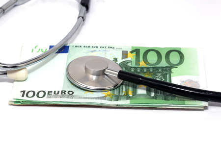 expensive health treatment stethoscope hundred euro banknotesの写真素材
