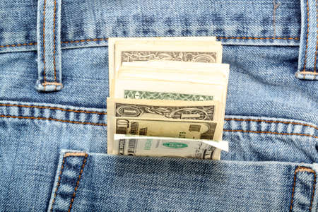 american dollar banknotes in jeans pocket focus on moneyの写真素材