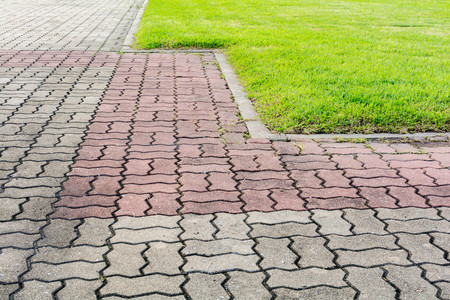 Brick and grass pattern in the garden or texture backgroundの写真素材