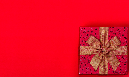 Christmas gifts on red backgroundの写真素材