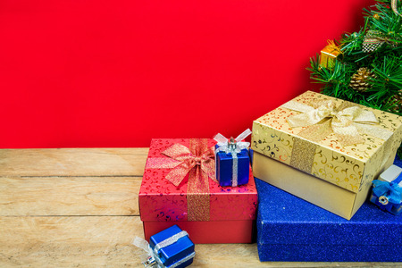 Christmas gifts on red backgroundの写真素材