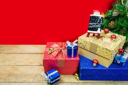 Christmas gifts on red backgroundの写真素材