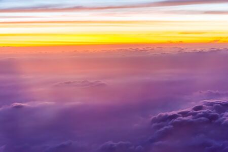 Clouds in the evening sky. Looking through the glass planeの写真素材