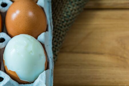 Fresh egg on a wooden tableの写真素材