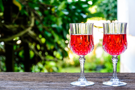 glass of water on Old wooden table and abstract backgroundの写真素材