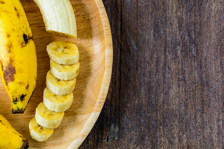 banana yellow on old wood  texture backgroundの写真素材