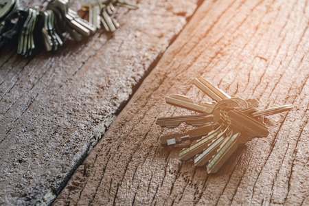 key home on old wood table background