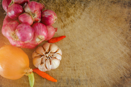 Shallot onion garlic on wood at kitchenの写真素材