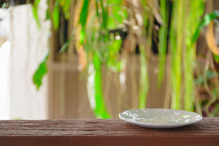 Plate on wood tree background at daytimeの写真素材