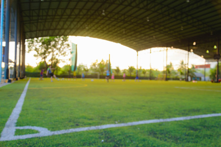 blur focus Children play football in the practice fieldの写真素材