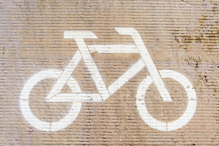 Bicycle runner and white bike symbol on the streetの写真素材