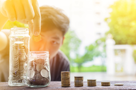 Growing silver coins and saving money step succeed blur bokeh backgroundの写真素材