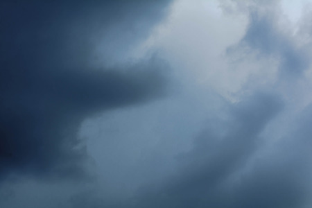 Dark sky with black clouds before rain on the air