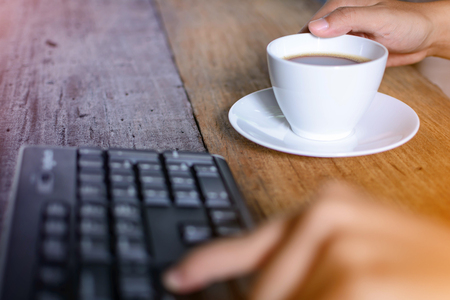 coffee cup clock and work on table  the good morningの写真素材