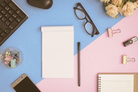 Flat lay office equipment on the desk with business workspace and vintage toneの写真素材